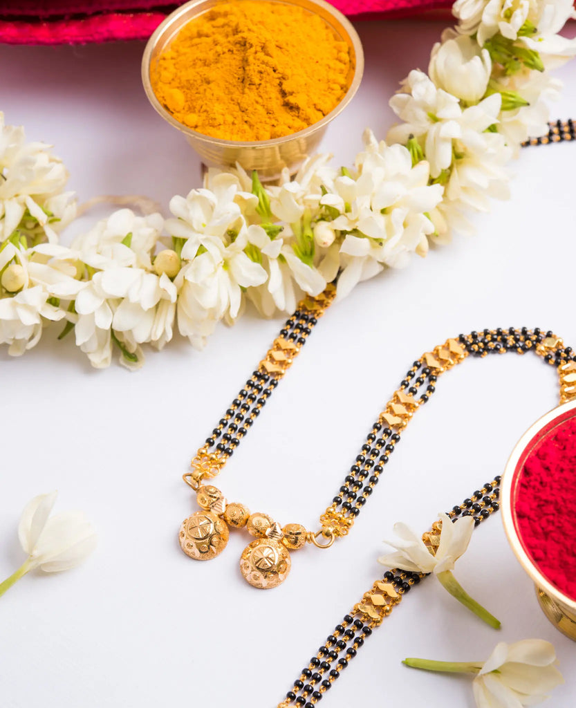 Mangalsutra With Red Tikka And Garland Of White Flowers